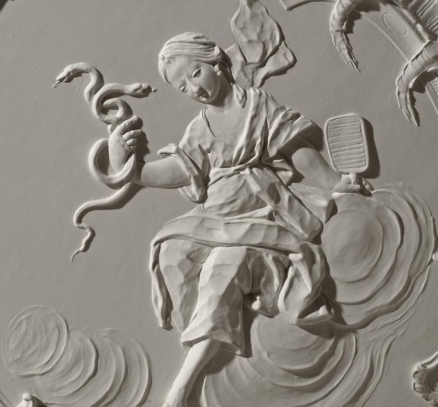 “Sapientia” with snake and mirror, late Rococo stucco in the Chapel Room at Meersburg New Palace, by Carlo Pozzi, 1760/62